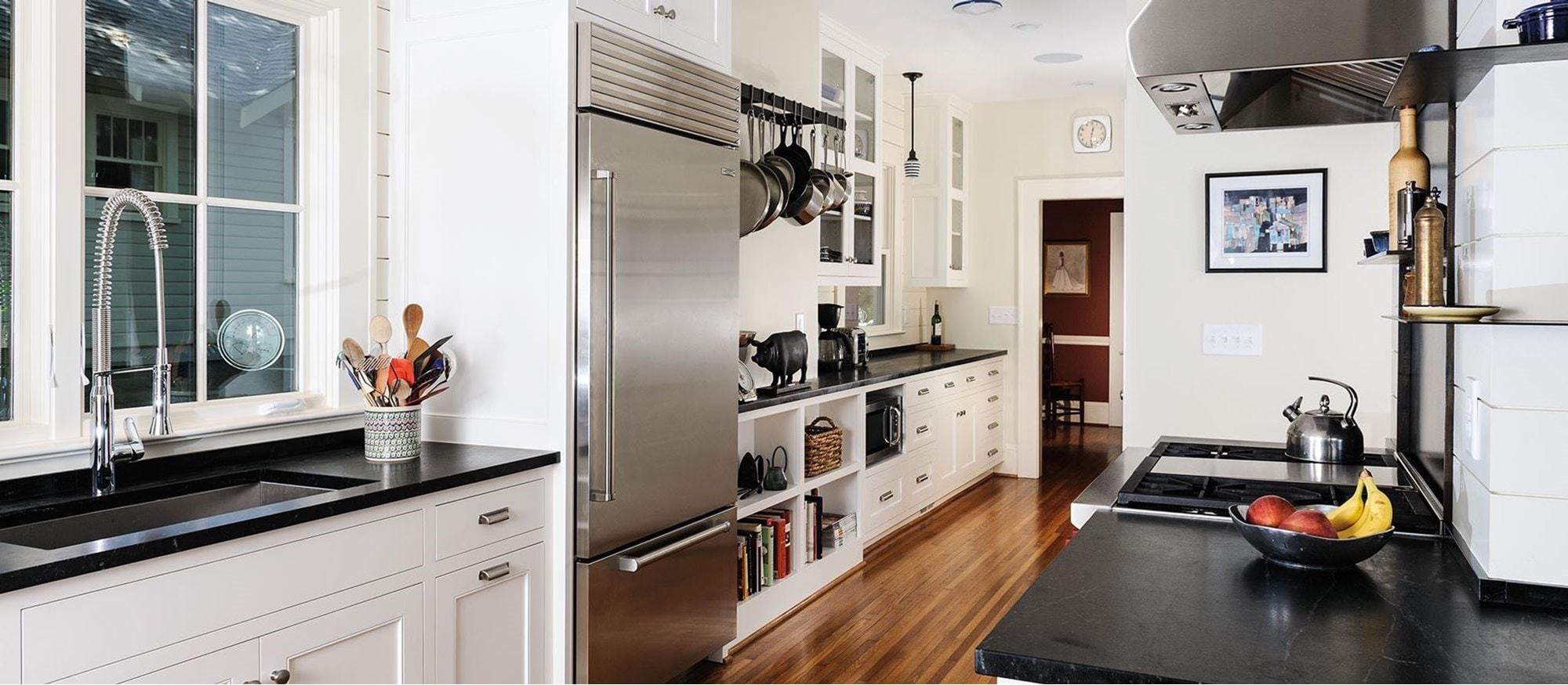 Sub-Zero Repair Service 1 Kitchen with a built-in stainless refrigerator, farmhouse sink and range hood