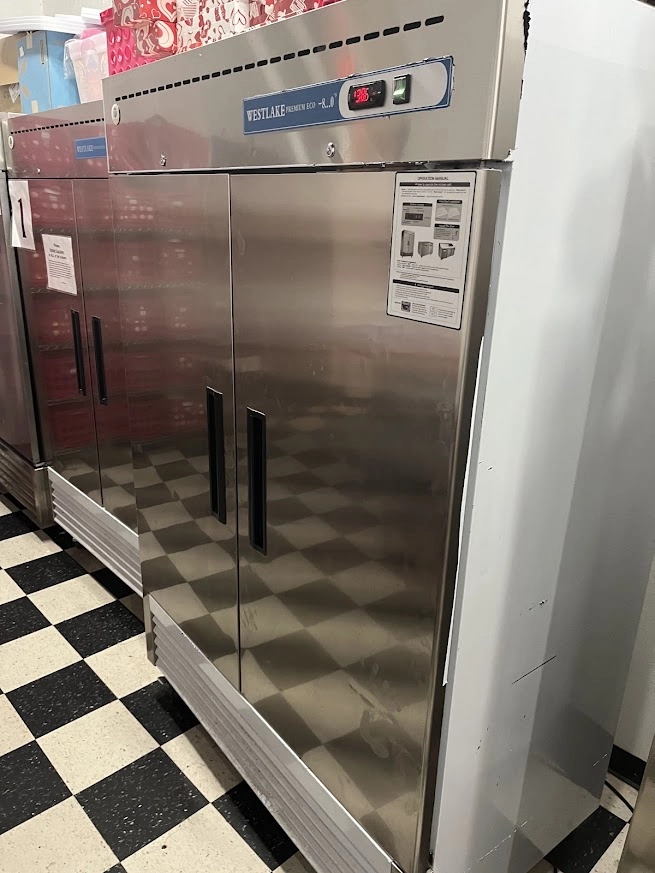Appliance Repair Services in Edmond & OKC 10 Tall stainless commercial freezer in a tiled kitchen.