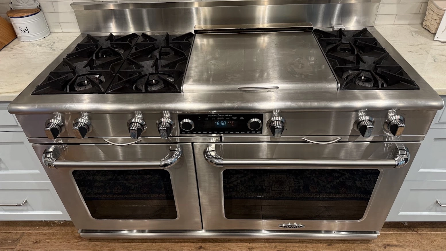 Stainless Capital gas range with two ovens and a center griddle.