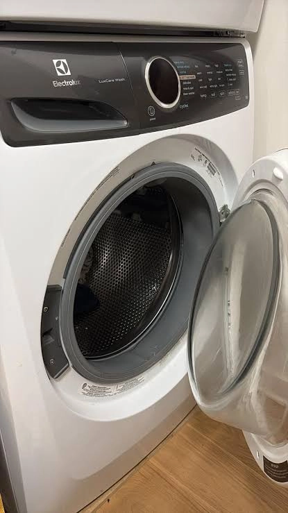 White Electrolux front load washer with door open.