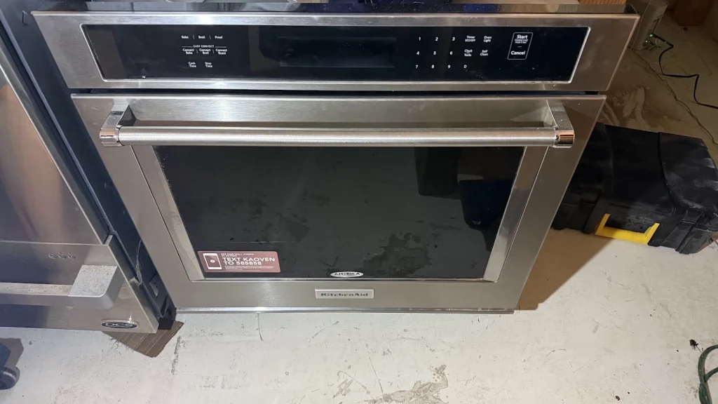 KitchenAid Appliance Repair in Edmond & OKC 5 Stainless KitchenAid wall oven installed below a countertop.