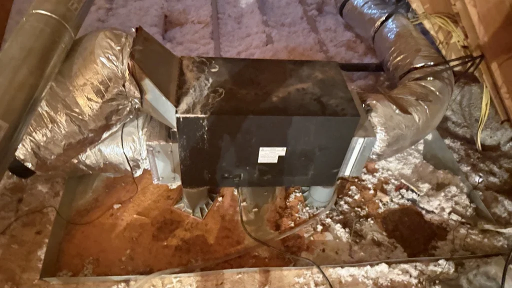 Wine cellar cooling system and insulated ductwork in an attic.