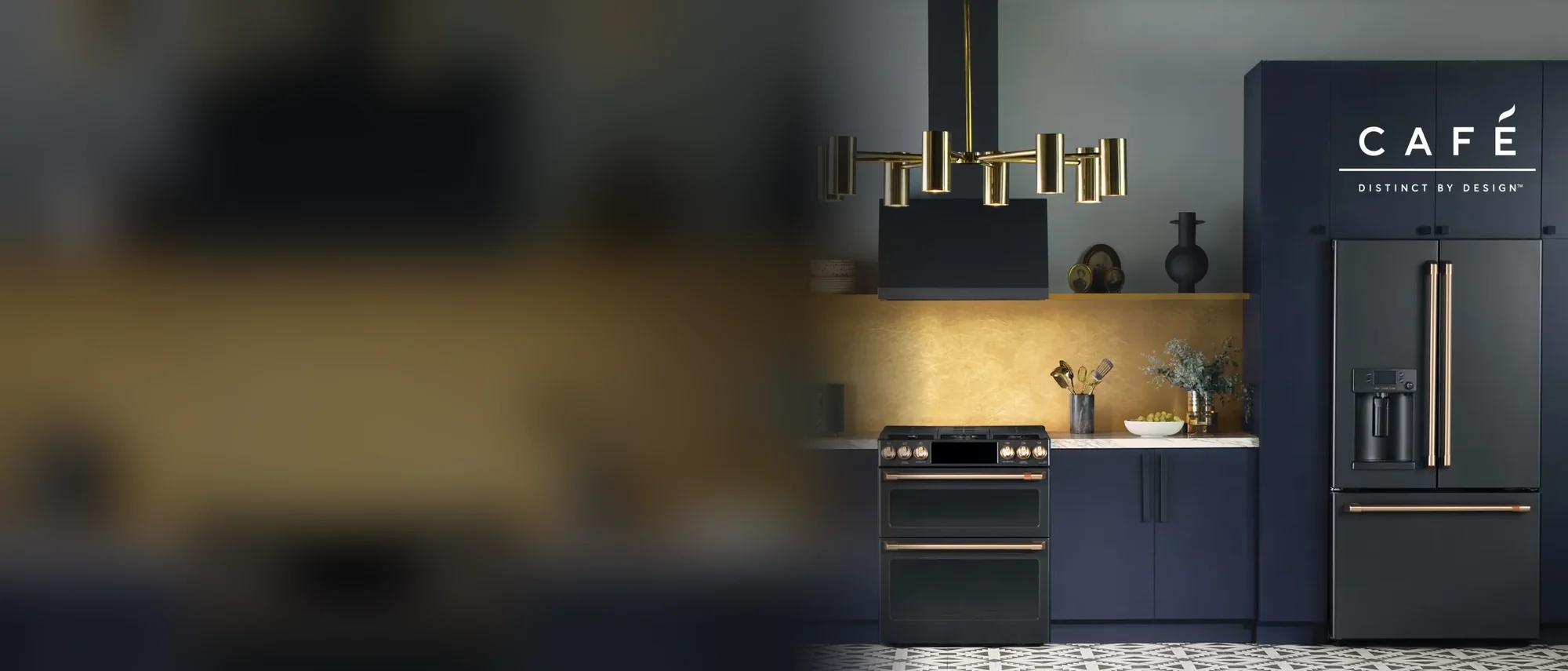 Café matte black range and French-door refrigerator in a navy kitchen