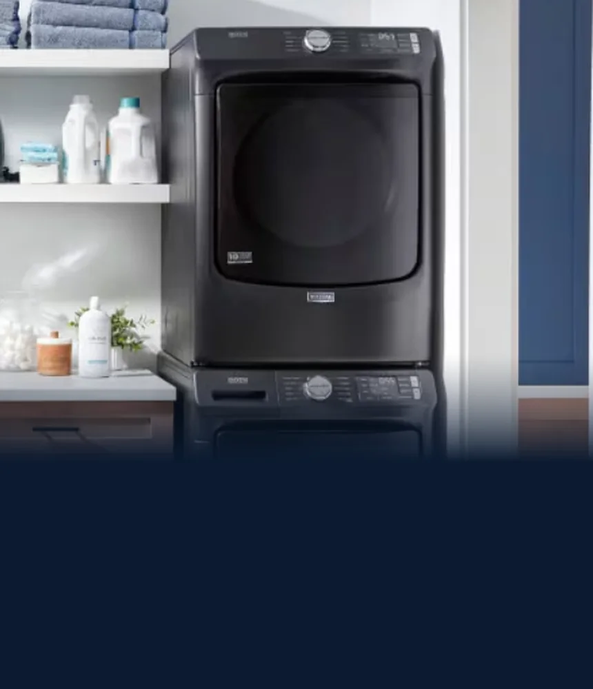 Black Maytag stacked washer and dryer in a laundry room