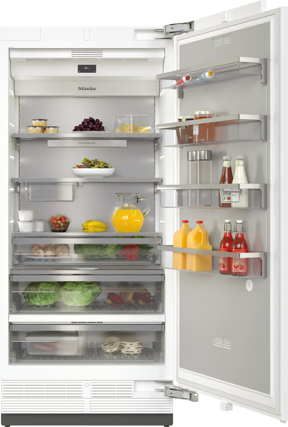 Miele built-in refrigerator with its door open, showing shelves and drawers