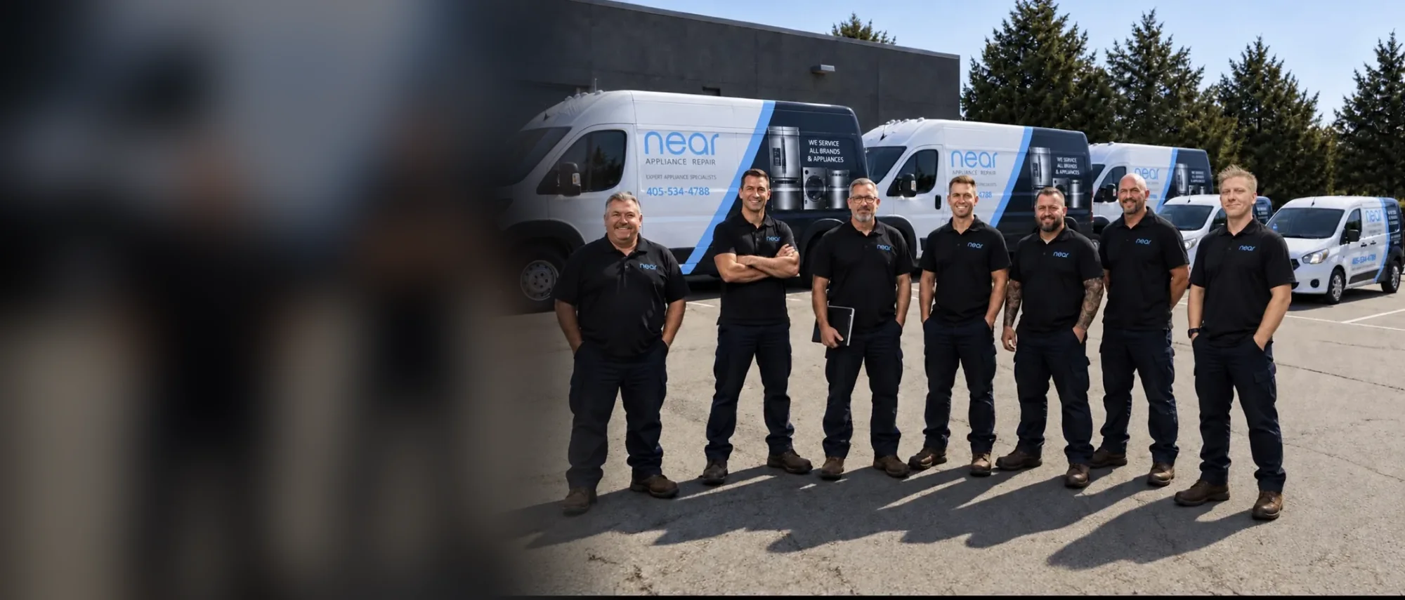 Near Appliance Repair technicians in front of their service vans