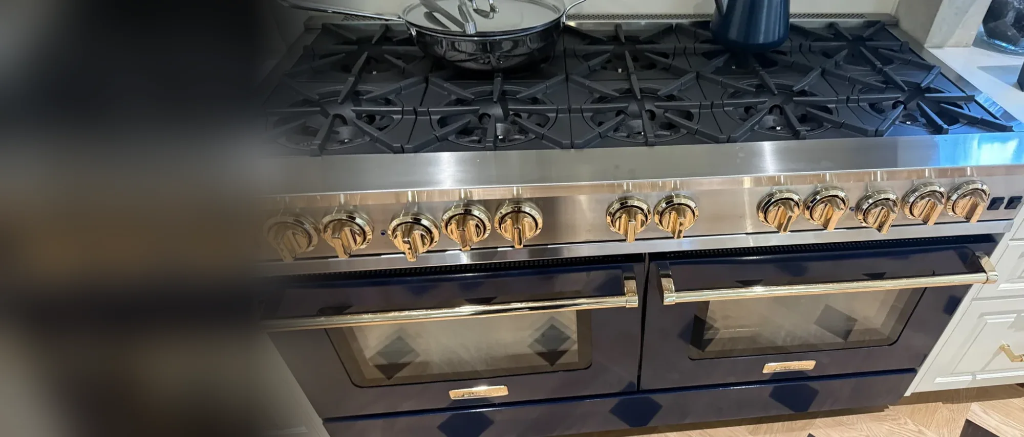 BlueStar-style double-oven range with brass knobs