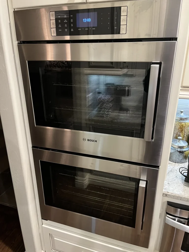Stainless steel Bosch double wall oven installed in kitchen cabinetry