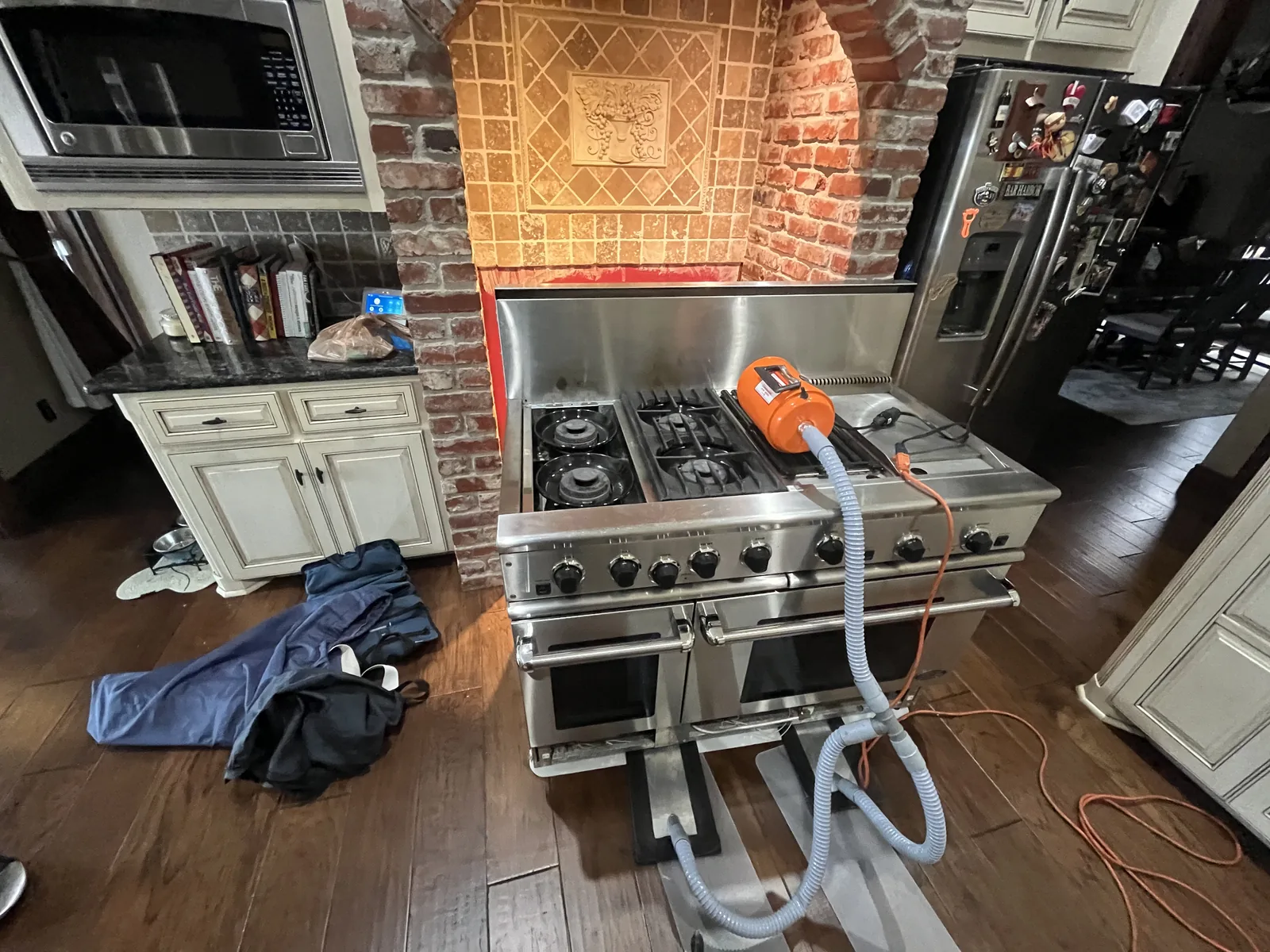 Capital Cooking gas range with service equipment and a protective cloth nearby
