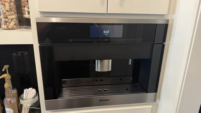 Built-in Miele coffee machine with an empty drip tray