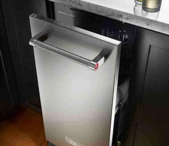 KitchenAid undercounter trash compactor with its drawer open