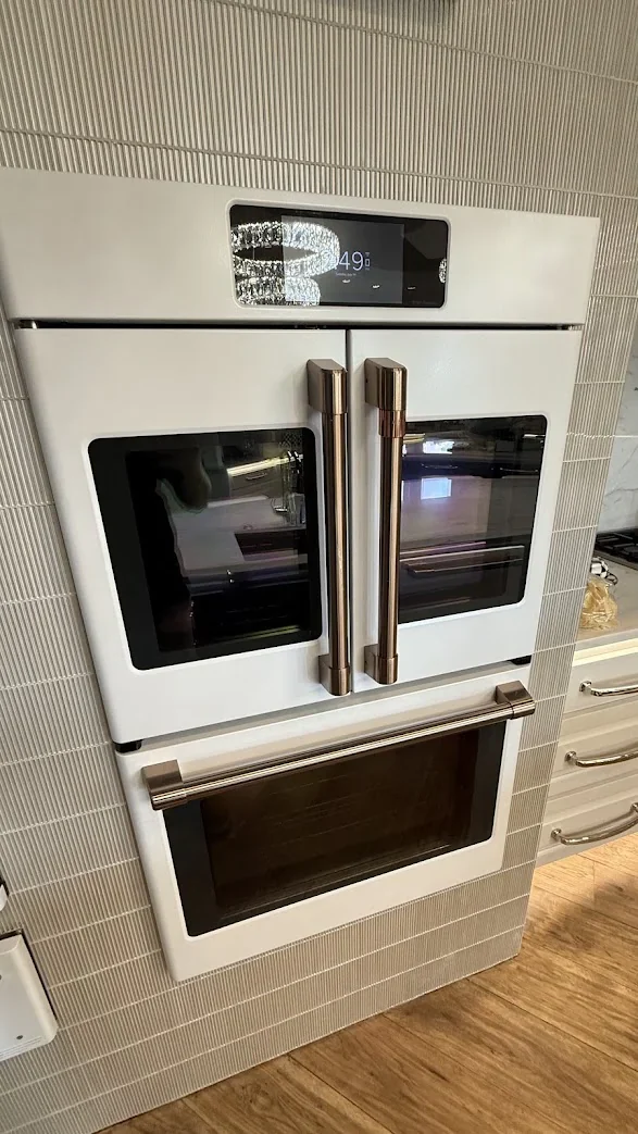 Built-in microwave and wall oven fitted into kitchen cabinetry