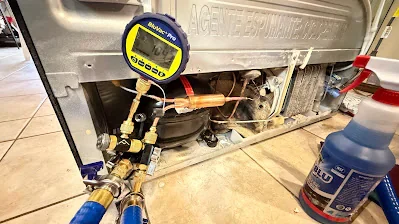 Refrigeration service equipment connected during a cooling-system repair