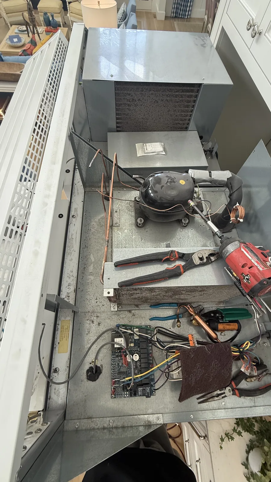 Exposed compressor, refrigerant tubing and electrical components in a True refrigeration unit