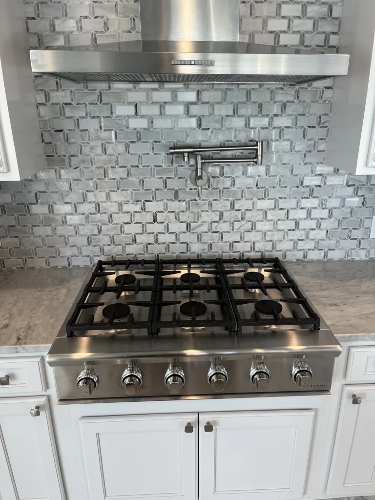 Stainless steel Viking gas rangetop with burner grates and front control knobs