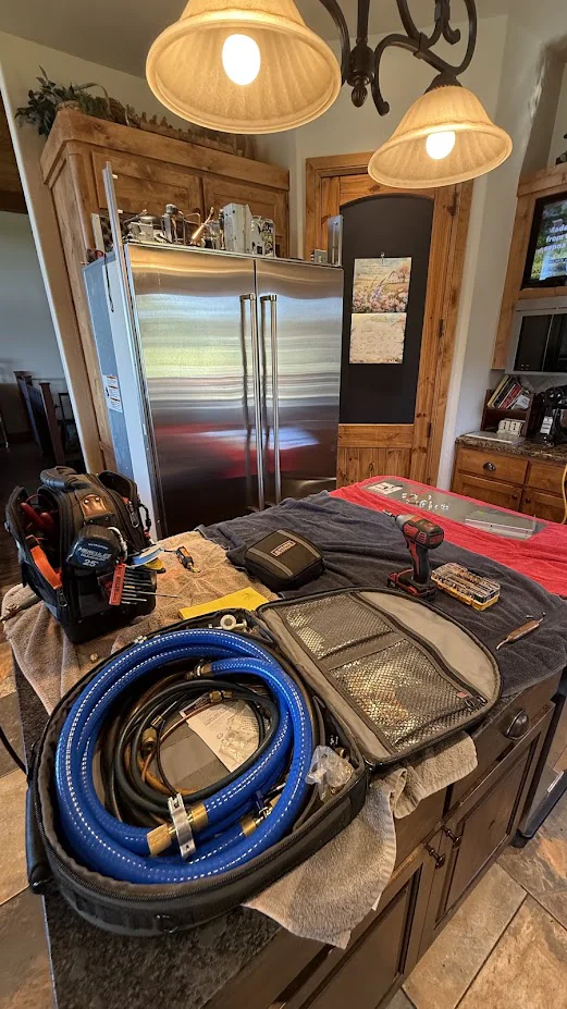 Nichols Hills Appliance Repair 2 Service equipment set up in front of an open built-in refrigerator.