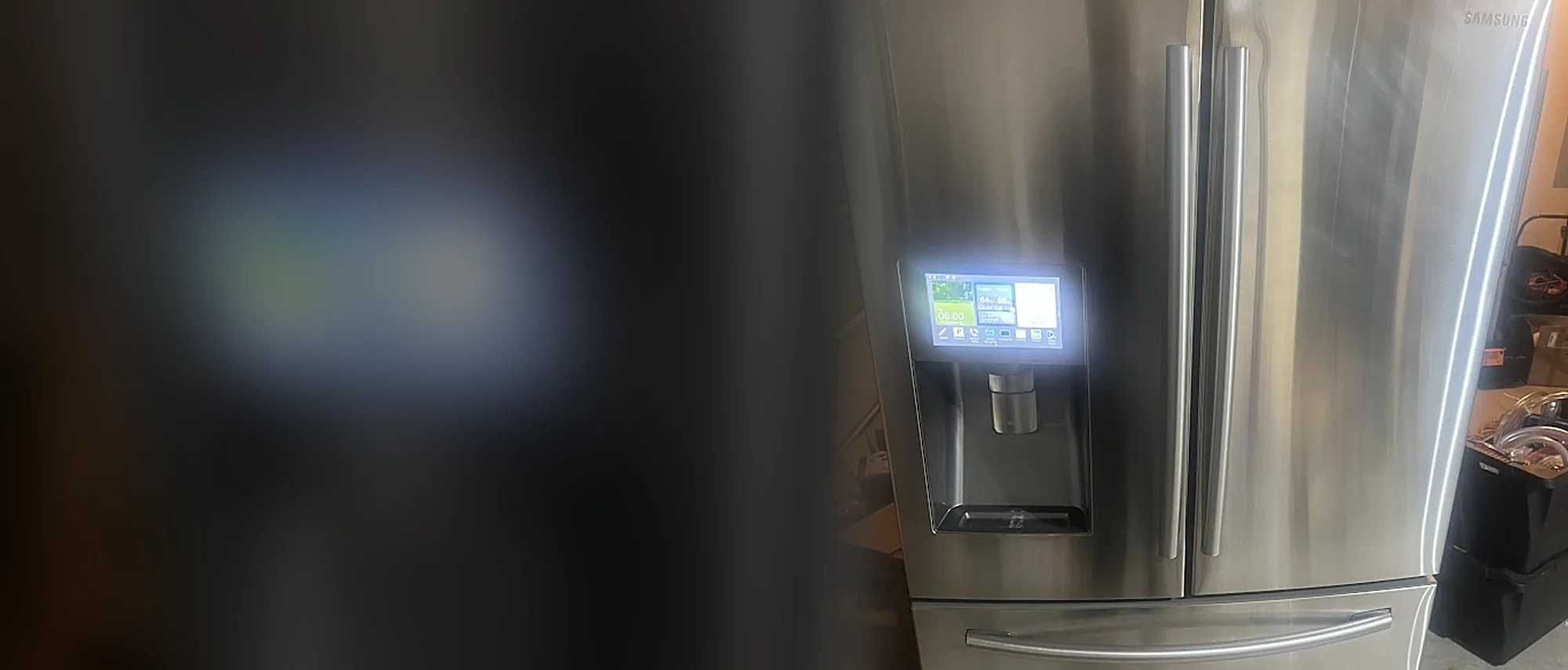 Samsung French-door refrigerator with a lit water and ice dispenser
