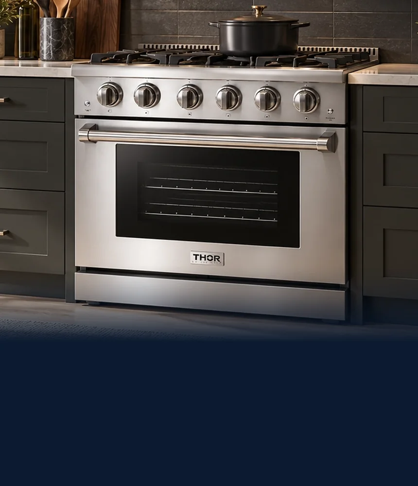 Stainless THOR Kitchen gas range under a matching range hood