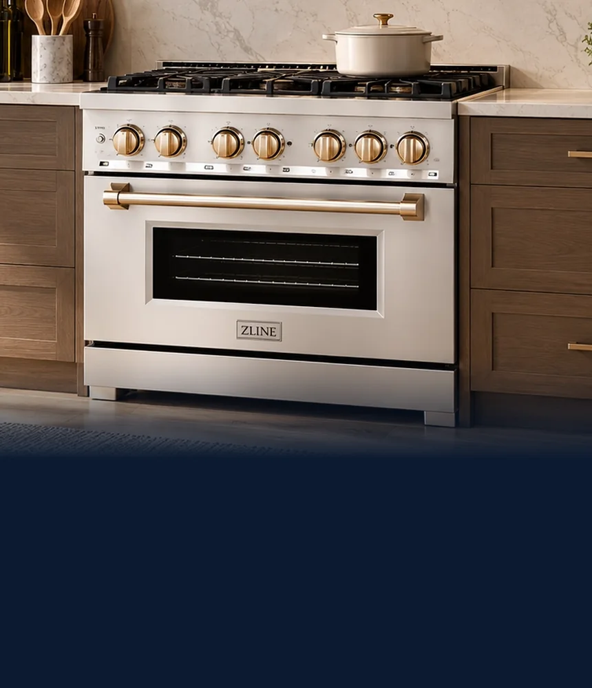 Stainless ZLINE range with gold knobs and handle between wood cabinets
